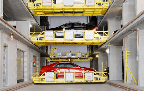 3 vehicles on lifts in U-tron's automated parking system.