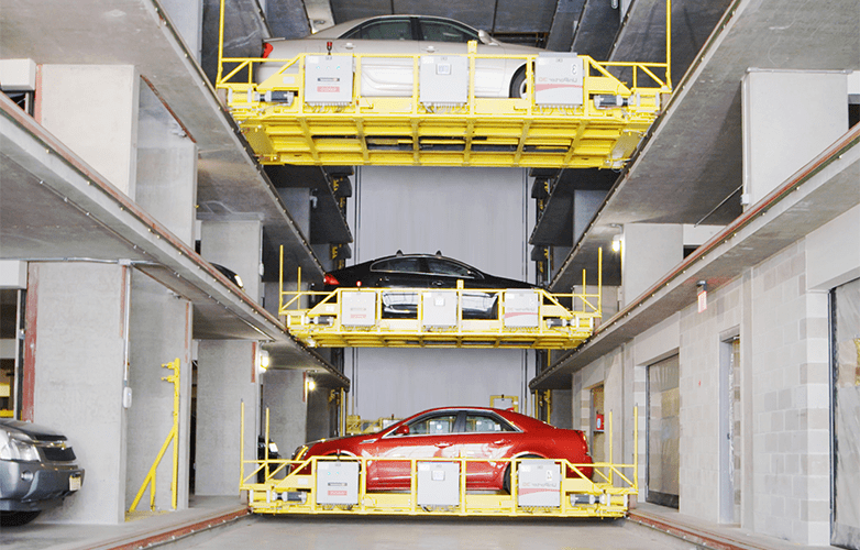 3 cars on a lift in a U-tron automated parking system